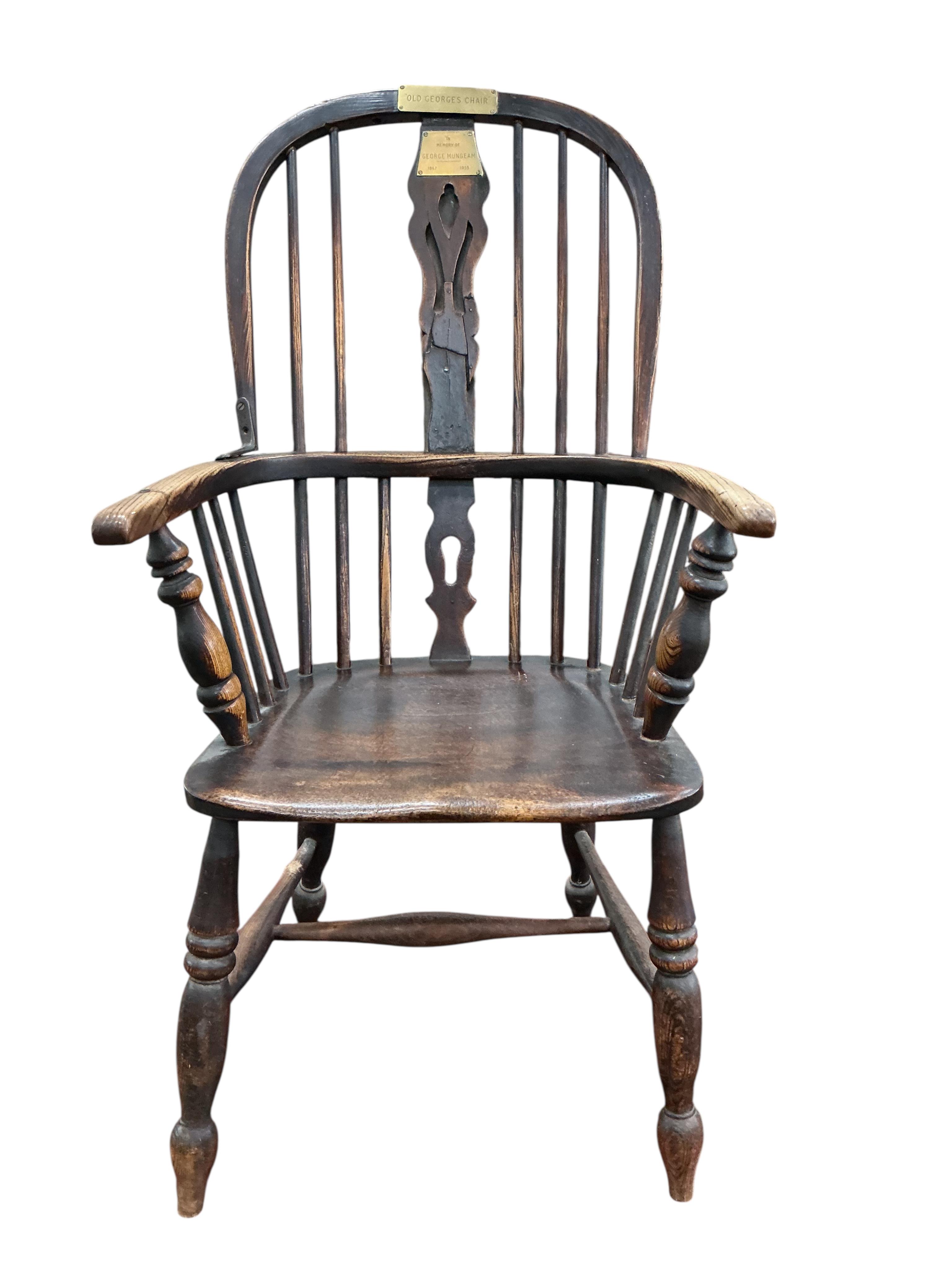 A Victorian ash and elm Windsor armchair, with brass commemorative plaques 'Old George's Chair', width 56cm, depth 46cm, height 102cm